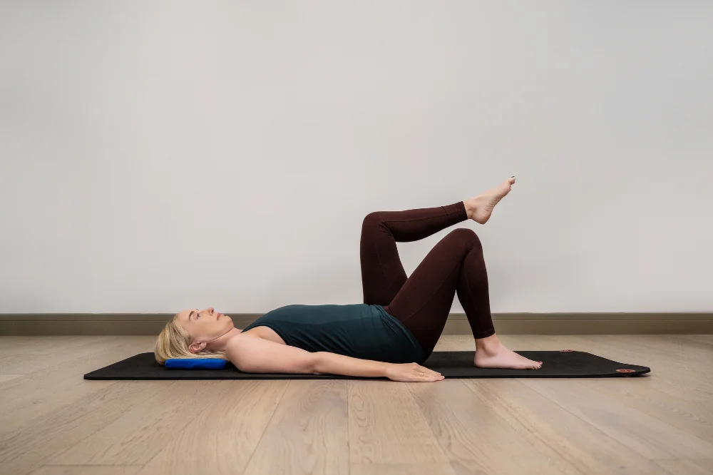 Jeannie Di Bon demonstrating a floor-based stability exercise from the Integral Movement Method